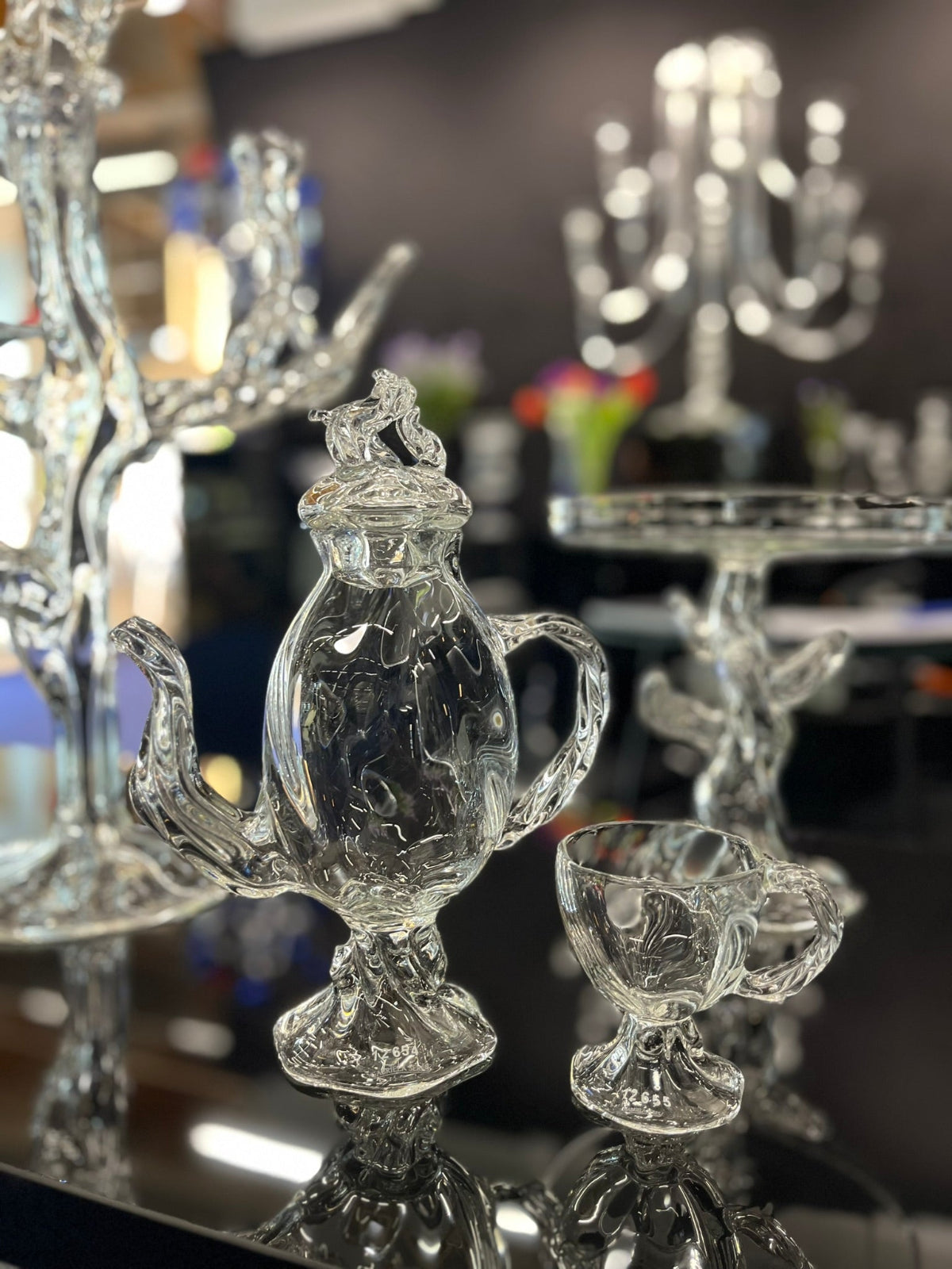 Close-up of optic teapot and teacup handmade in a exhibition stand setting