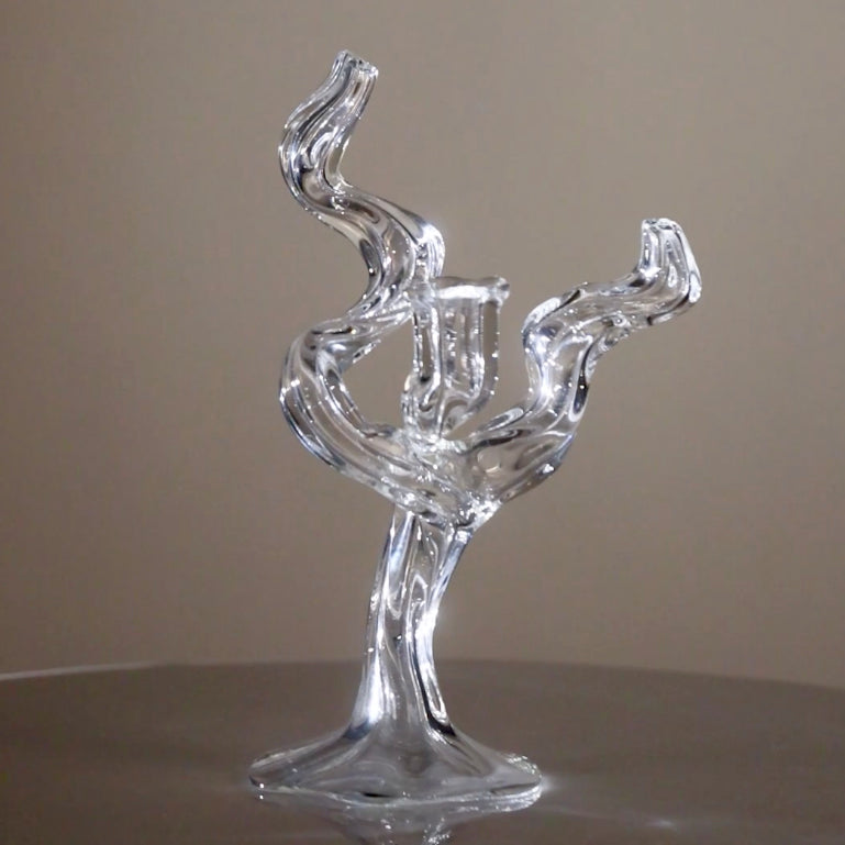 Spining tree shaped small candleholder with light sparkling on its crystaline beauty