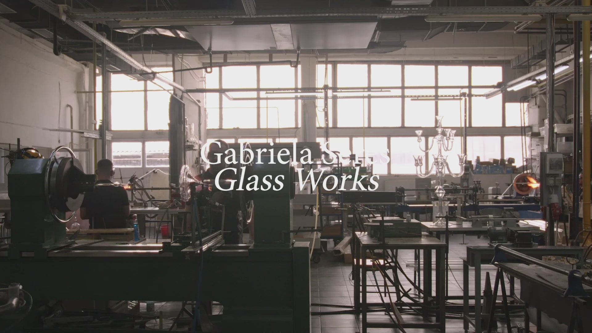 Video of atelier and glassblowing taking place in the Gabriela Seres atelier. People working at lathes, by hand and at different stages of work