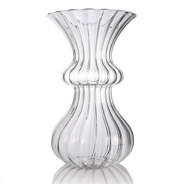 A clear glass vase with a tulip-shaped design, handmade.