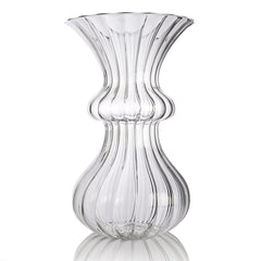 A clear glass vase with a tulip-shaped design, handmade.